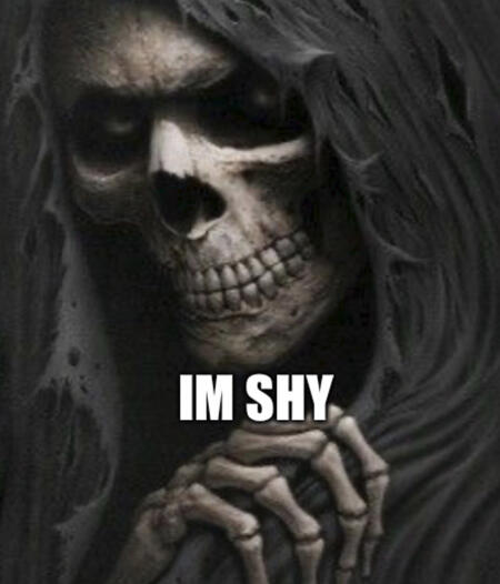terrifying image of a skeleton with the text "im shy" is block letters over it